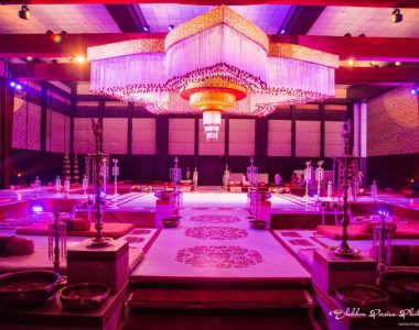 qawwali-night-decor-featuring-flower-chandelier-bolsters-and-embroidered-walls