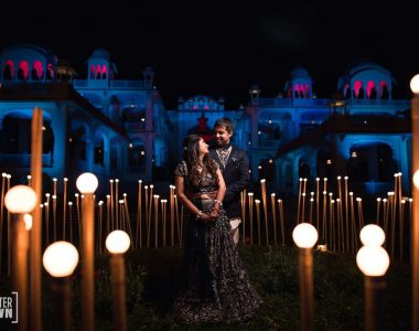 sangeet-outfit-idea-black-lehenga-green-lehenega-black-sherwani-sangeet-decor-quirky-decor-bride-and-groom-in-their-sangeet-outfit-captured-in-a-candid-shot