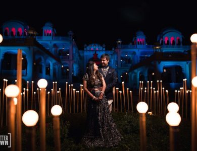 sangeet-outfit-idea-black-lehenga-green-lehenega-black-sherwani-sangeet-decor-quirky-decor-bride-and-groom-in-their-sangeet-outfit-captured-in-a-candid-shot
